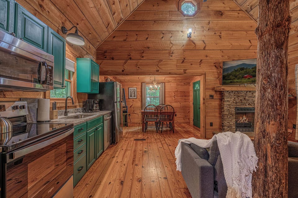 Kitchen, fireplace, and a whole lot of cabin character.