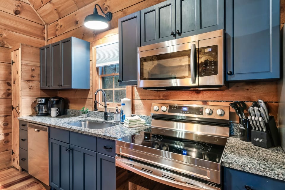 Fully equipped kitchen with granite counters and stainless steel appliances