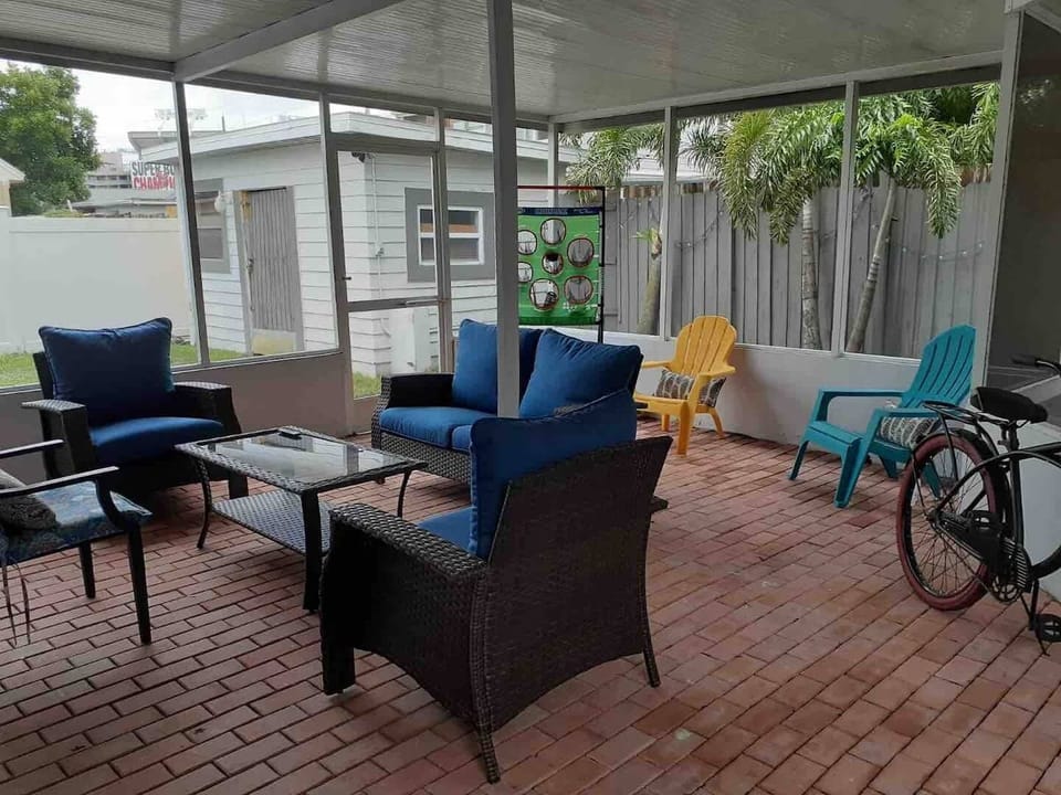 Patio, can see stadium.  TV and chairs.    Palm Trees and Xmas lights