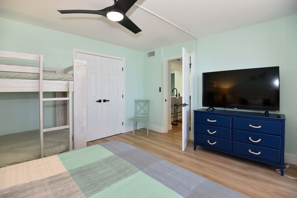 Second bedroom is accessible right of dining/bar seating area