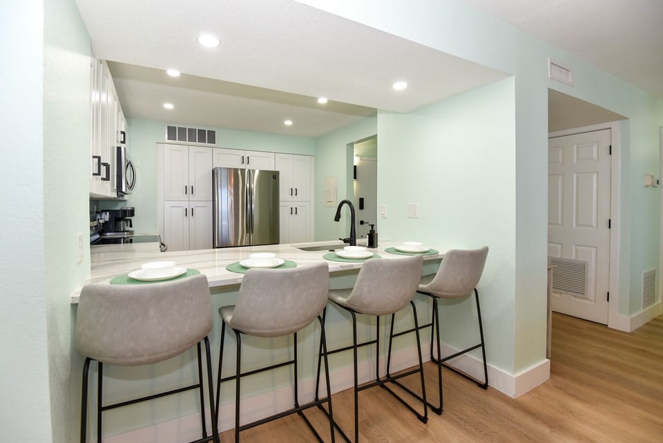Plenty of bar seating open to the kitchen