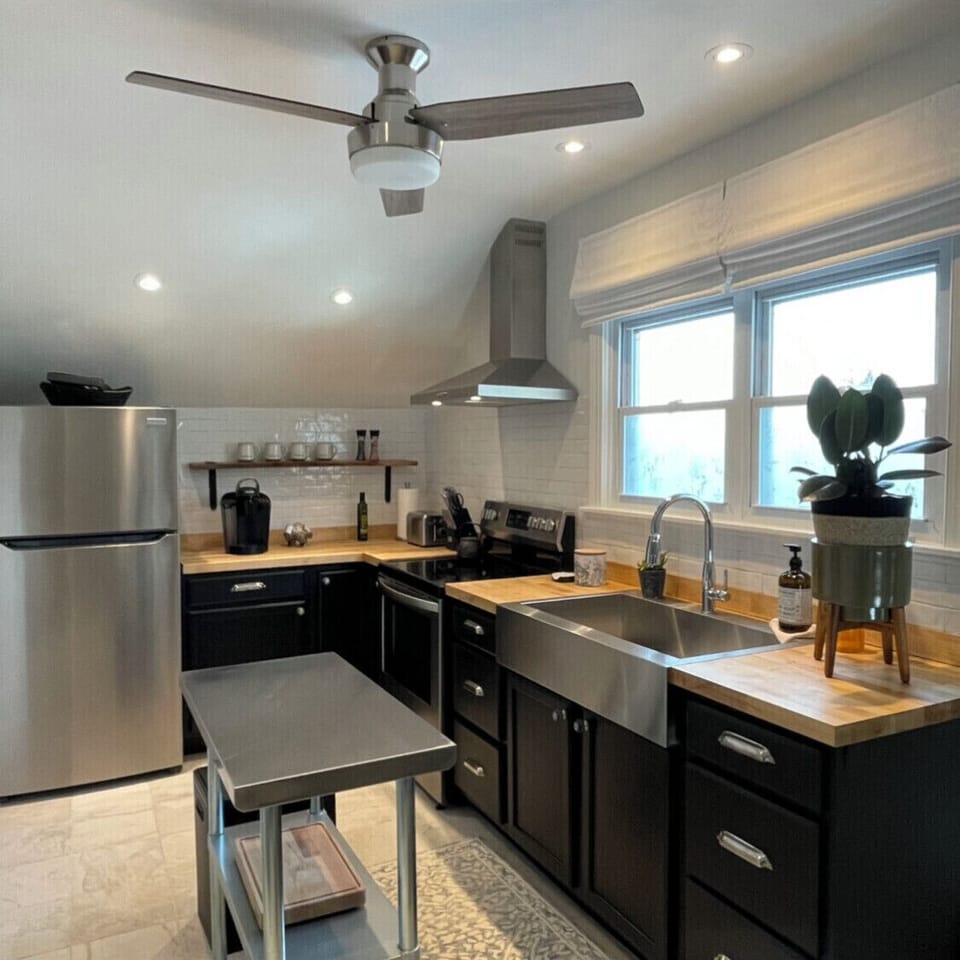 Fully stocked kitchen. Pots, pans, glassware, utensils and microwave. 