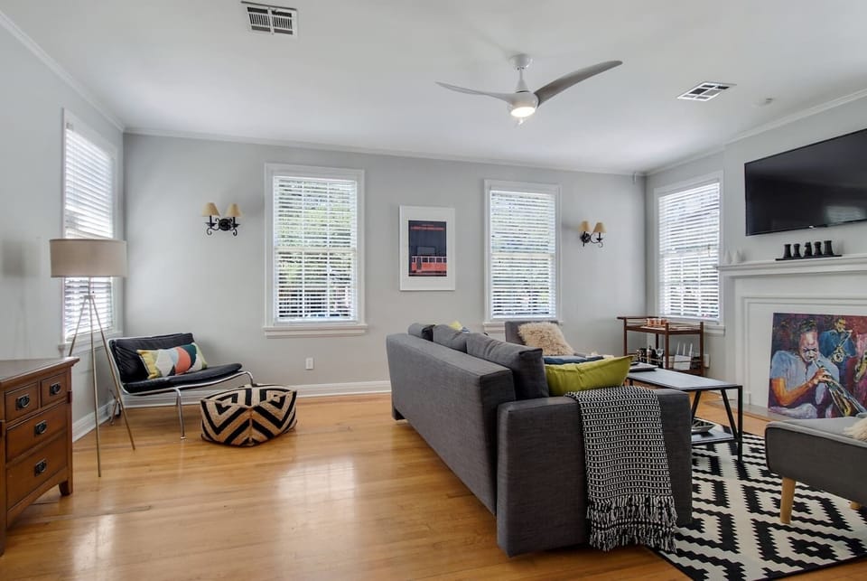 Living room features a sectional sofa & large screen smart tv. (Note, sofa has changed since photo - it is larger and seat more guests comfortable).