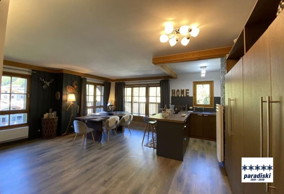 Spacious living area with dining and kitchen