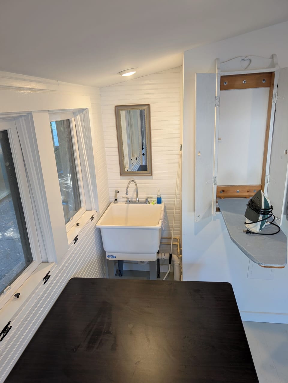 Laundry Room with Ironing Board and Utility Sink