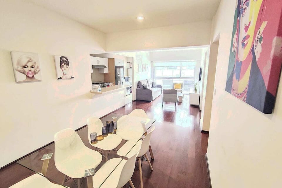 The dining and living room area is a stylish and spacious open-concept space, seamlessly blending together for effortless entertaining and comfortable living. It provides a perfect setting for enjoying meals, relaxing with loved ones, and creating me