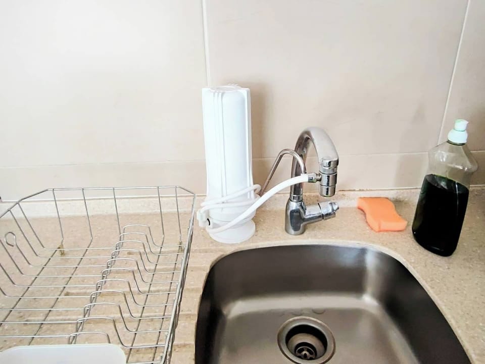 The kitchen in the apartment is equipped with a drinking water filter, providing clean and filtered water for your convenience and peace of mind.