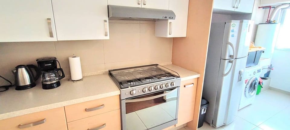 The laundry room is conveniently located next to the kitchen and is equipped with a washer/dryer for your laundry needs, allowing you to freshen up your clothes during your stay.