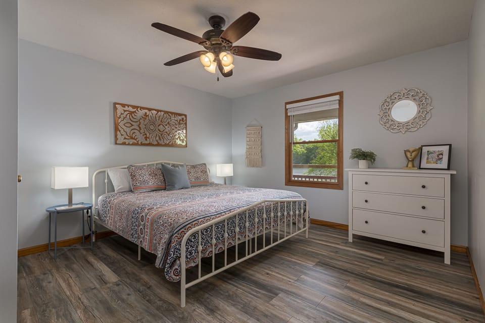 Main level bedroom with king bed