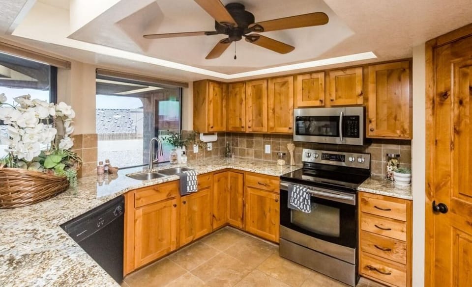 Side view of kitchen with stainless steel appliances.