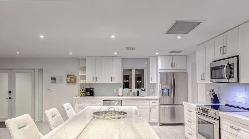 Open Layout Kitchen with Marble Countertops & Stainless Steel Appliances.  Keurig & Regular Drip Coffee Maker, Filtered Water & Ice.  Fully Stocked with everything that you need to enjoy a simple dinner to a Thanksgiving Feast. 
