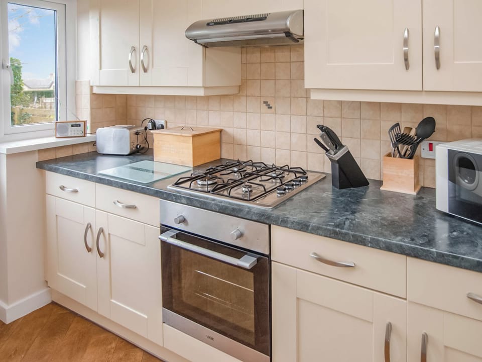 Kitchen | Gatekeepers Cottage - Celtic Haven Resort, Lydstep, near Tenby