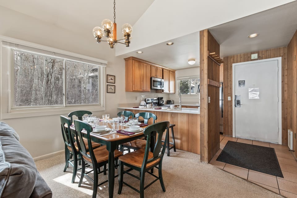 Premier Snow Flower Condominium 130's dining room and open concept kitchen.