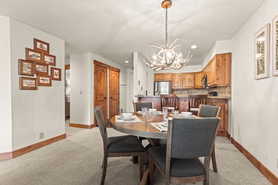 Snow Flower Condominium 149 offers a dining table with seating for four guests.