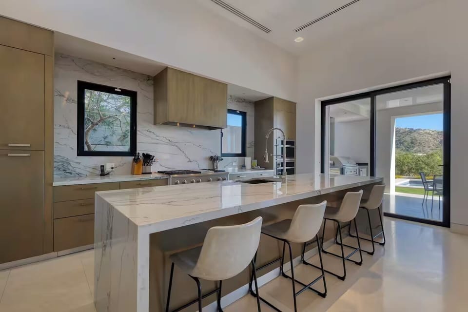 Chef's kitchen with GE monogram appliances, 2 dishwashers and wine fridge.