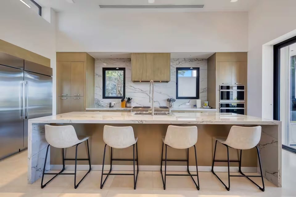 Chef's kitchen with GE monogram appliances, 2 dishwashers and wine fridge.