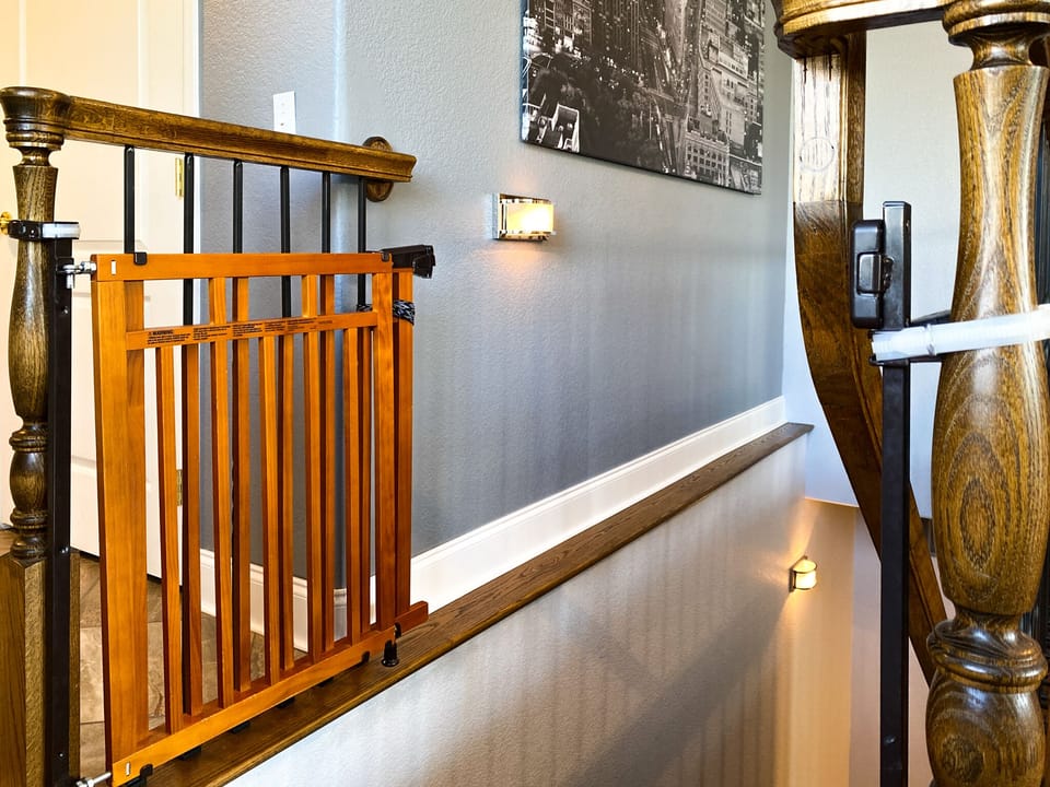 The staircase between floors with the child safety gate