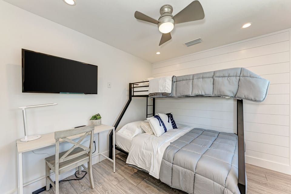 Guest bedroom #4 with bunk beds, desk & TV