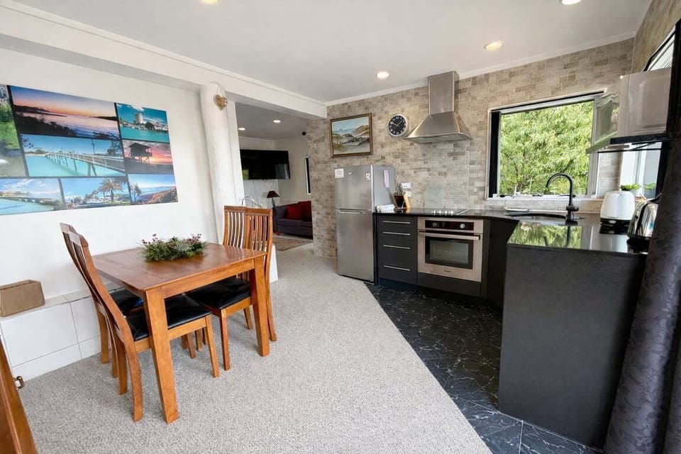 Bright, open kitchen and dining space — fully self-contained and ready for relaxed meals