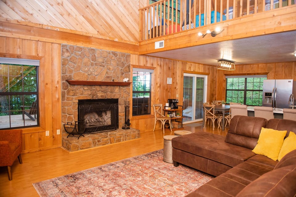 The main living space is open and airy with a wood-burning fireplace.