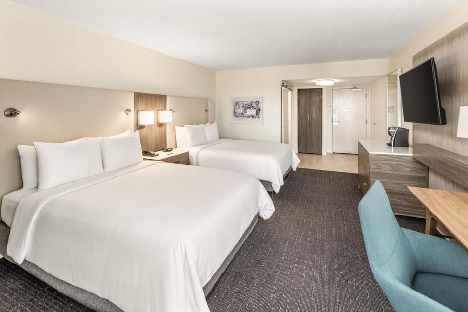 Unwind in crisp beds with roomy layout and HDTV.
