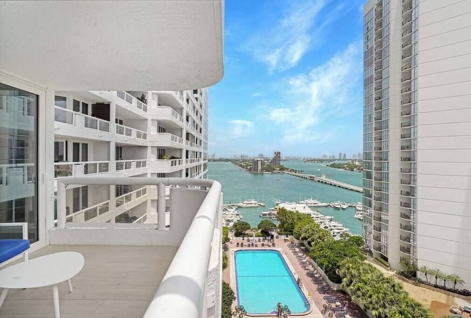 Furnished balcony with views of Biscayne Bay and Sea Isles Marina