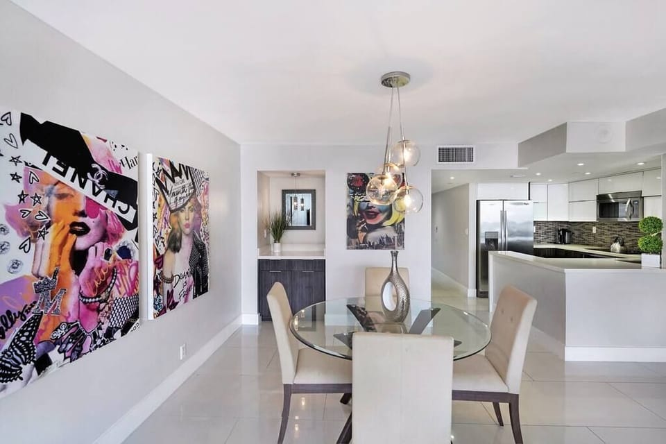Fully equipped kitchen, dining area, living room, balcony access