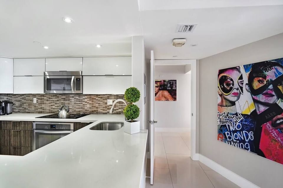 Fully equipped kitchen and entrance to master bedroom