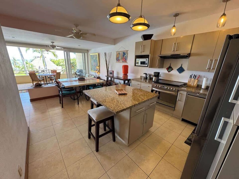 Fully equipped beach house kitchen with modern appliances