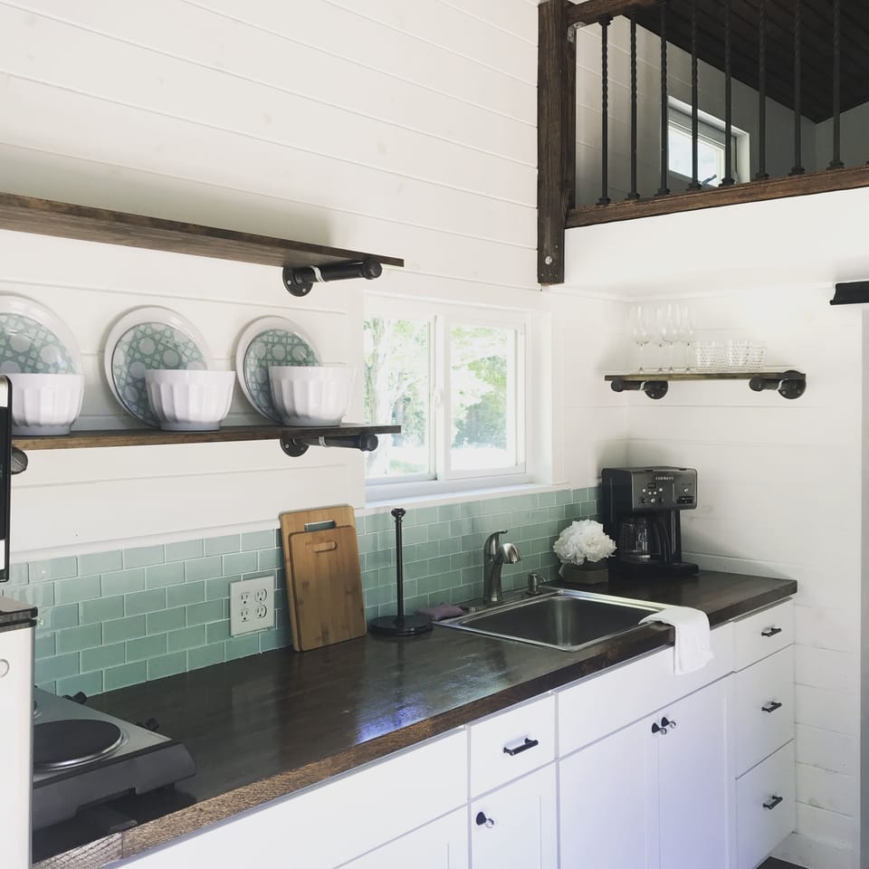 Cook top, coffee, microwave and fridge.  Perfect area to prepare and cook. 