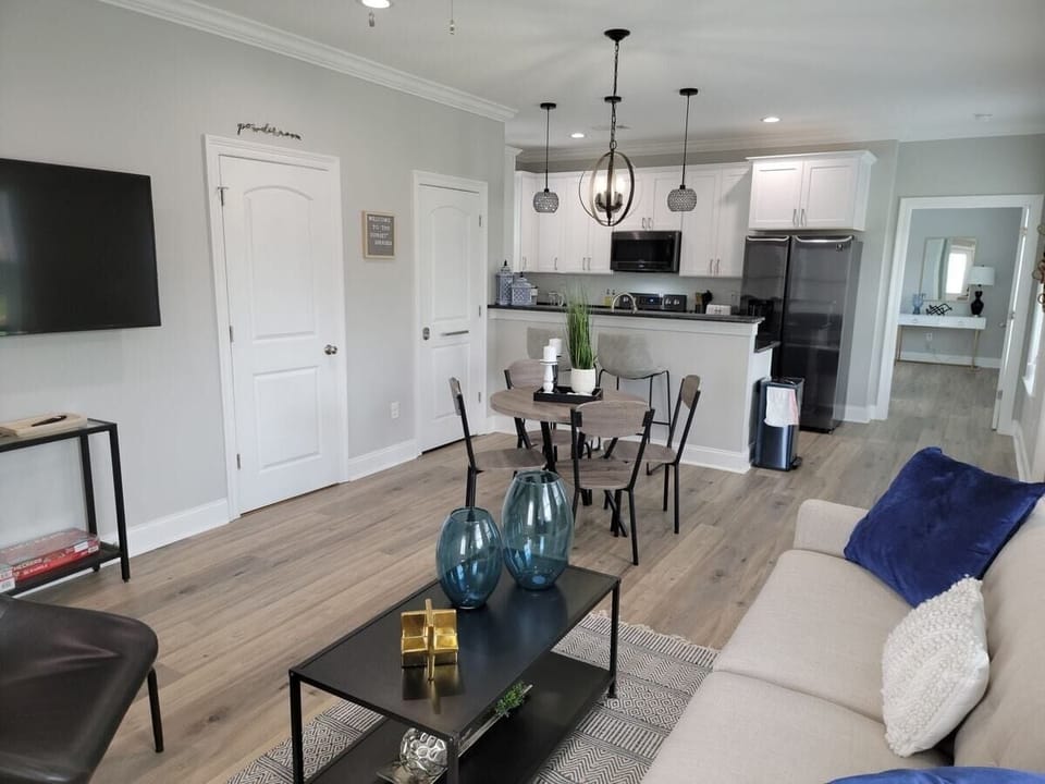 Living room/ Dining Room with kitchen in background 