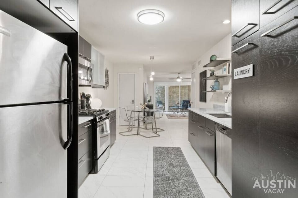 Fully stocked kitchen with dishwasher and washer & dryer