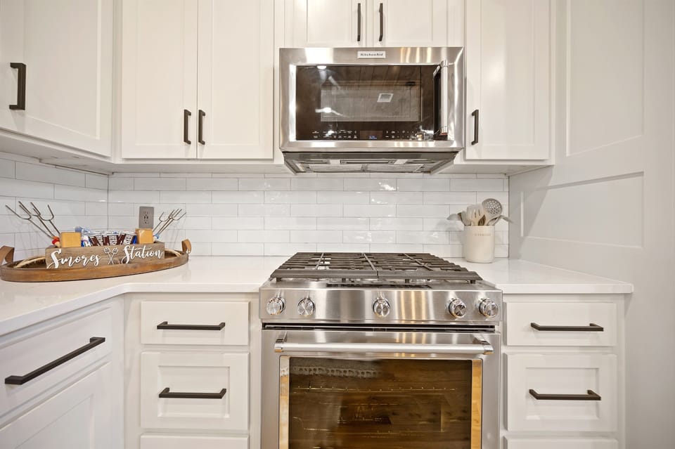 Stainless steel range and microwave for easy meal prep during your stay.