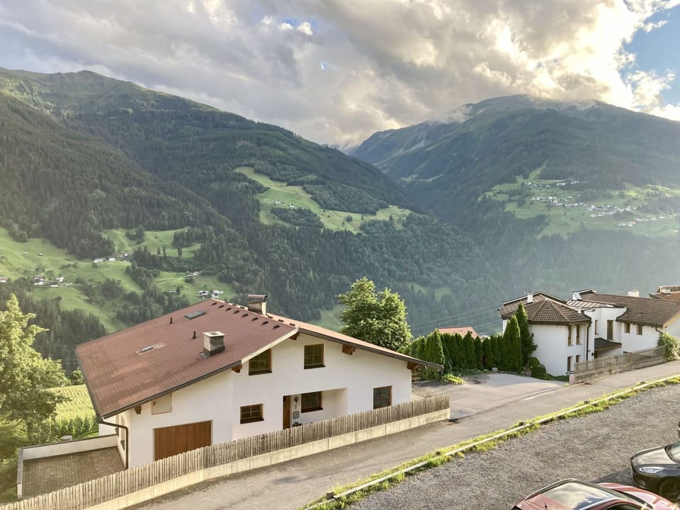 Cloud, Sky, Plant, Mountain, Building, Window, Highland, Vehicle, Slope, House