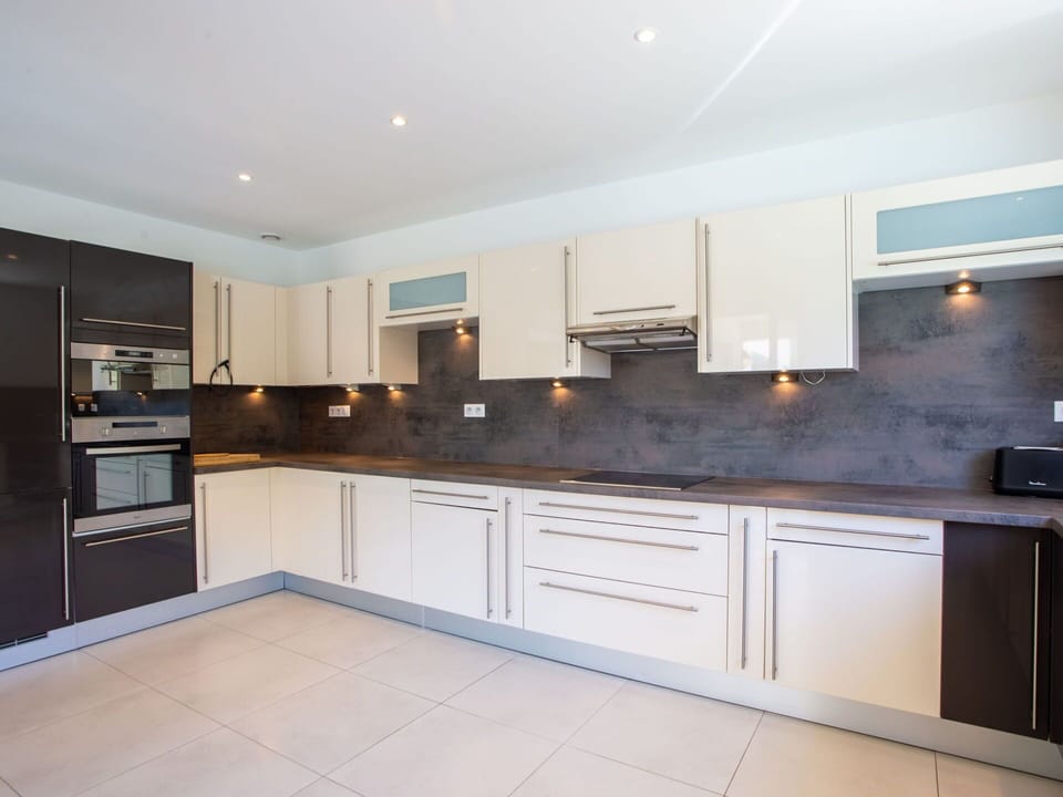 Countertop, Cabinetry, Kitchen Appliance, Kitchen, Kitchen Stove, Wood, Home Appliance, Lighting, Interior Design, Flooring