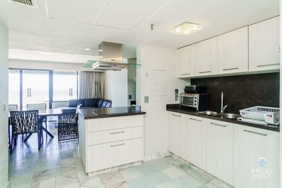 Fully equipped kitchen with oven, microwave, and fridge, perfect for any meal!