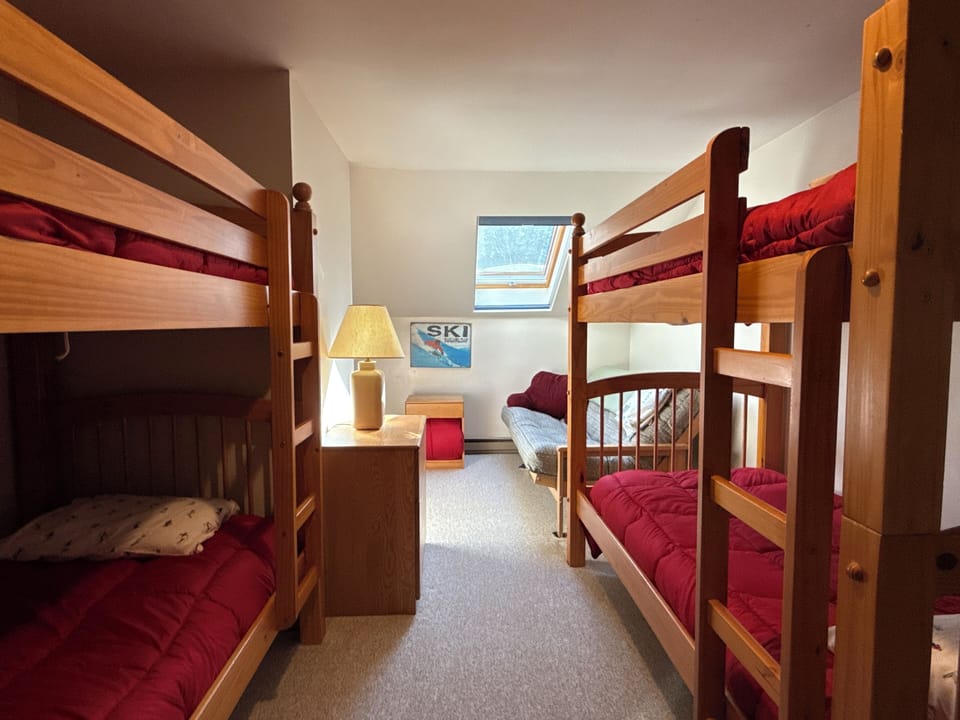 Upstairs bedroom with bunk beds and queen futon
