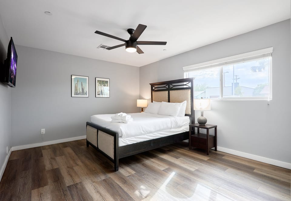 5th bedroom with a Queen bed, smart TV, and closet space.
