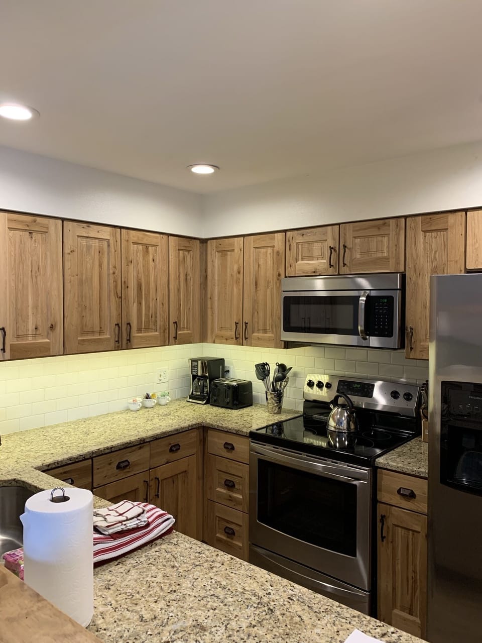 Updated kitchen with stainless appliances and granite countertops