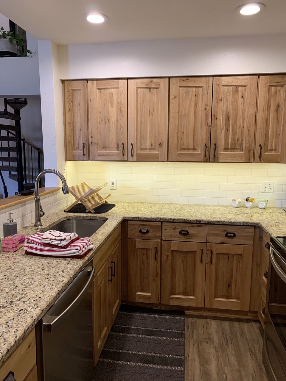 Updated kitchen with stainless appliances and granite countertops