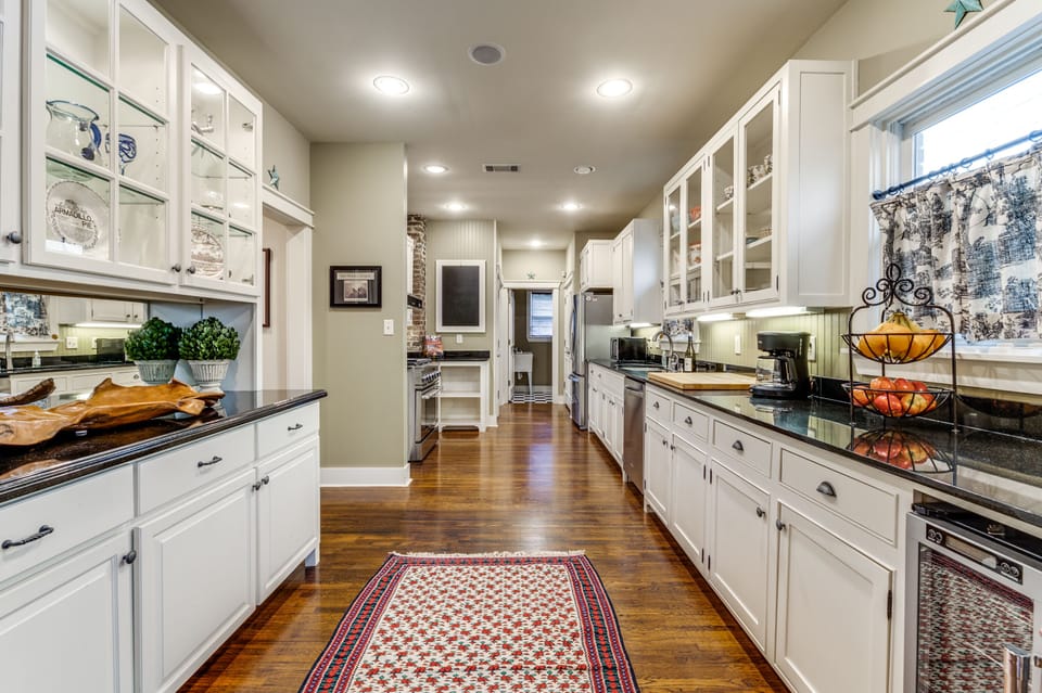 Fully Stocked Kitchen with stainless steel appliances and high end gas range. 