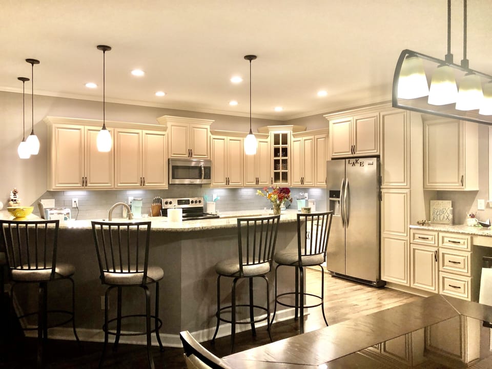 Kitchen has 6 barstools for in-kitchen dining.