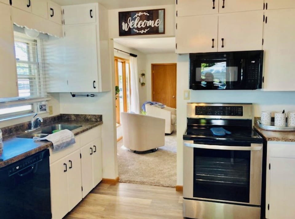 Updated eat-in kitchen with modern appliances and a stackable washer & dryer