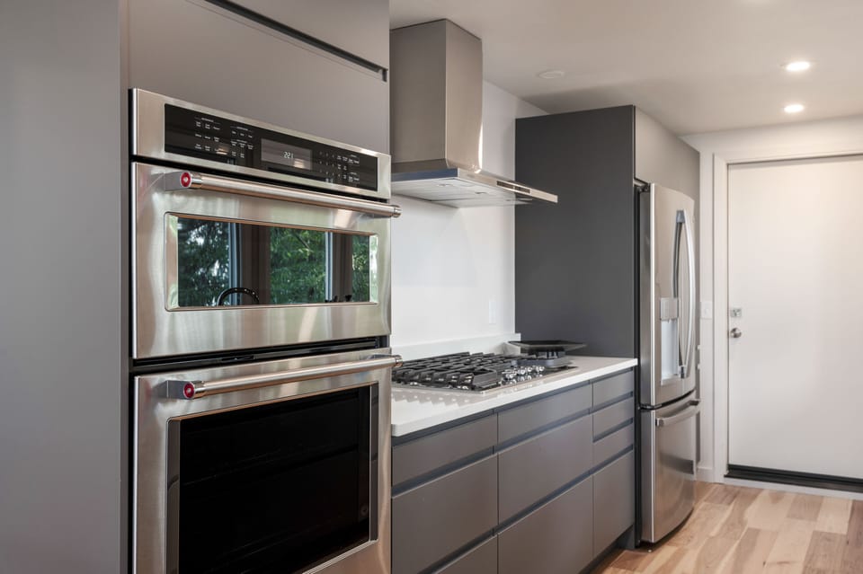 New stainless steel appliances including microwave, oven, fridge and gas range