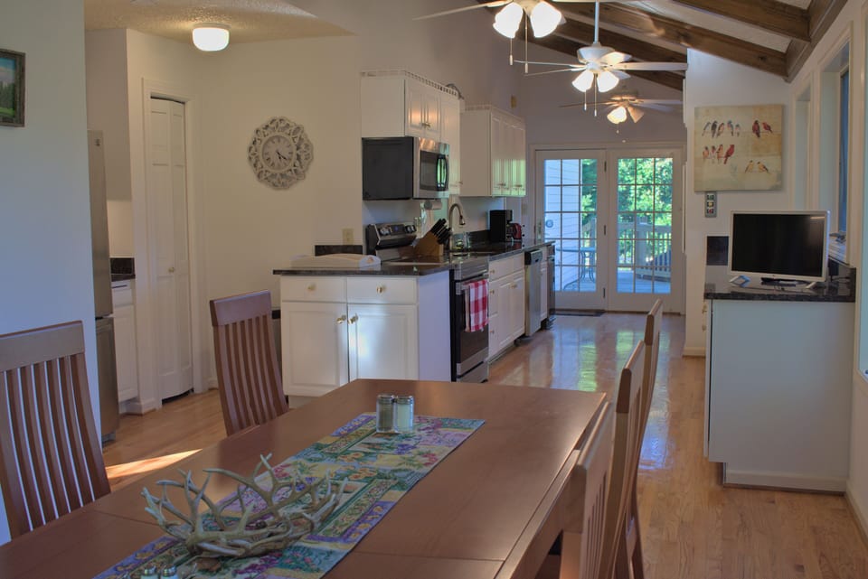 Large, well-equipped kitchen with a wall of windows facing the sunrise 