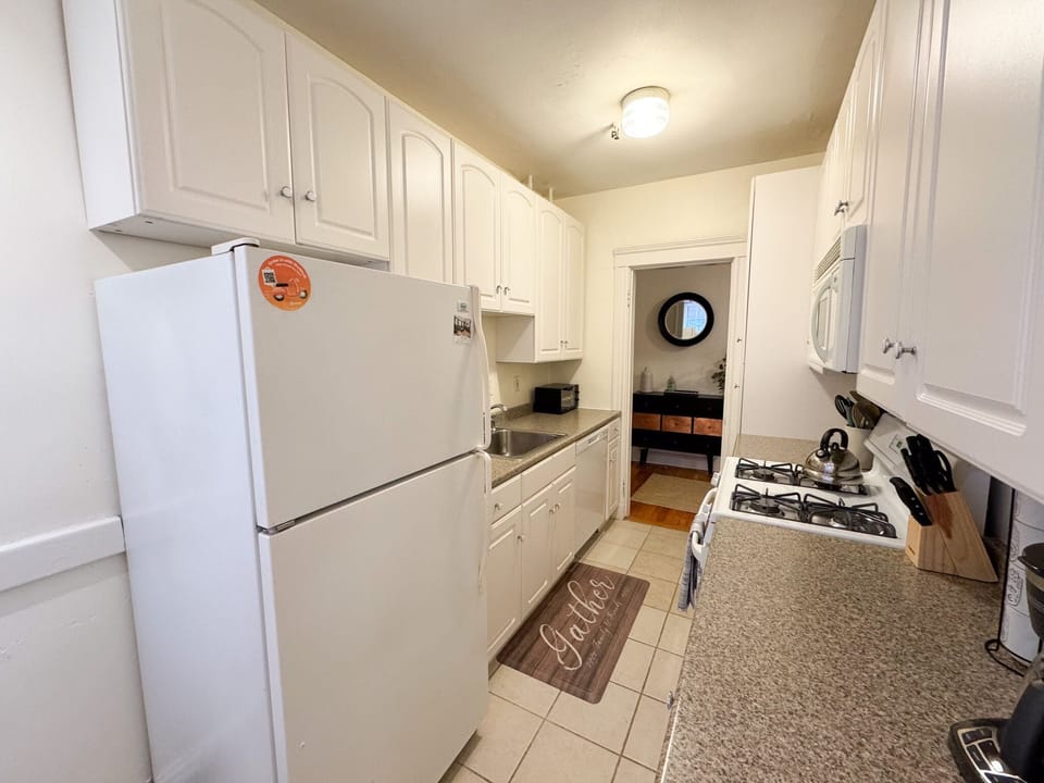 The kitchen features a gas range