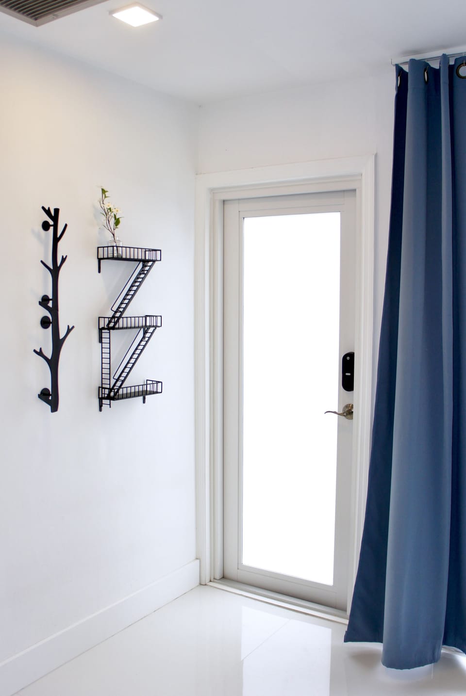 Frosted glass doors, coat hanger, sunglasses and key holder.