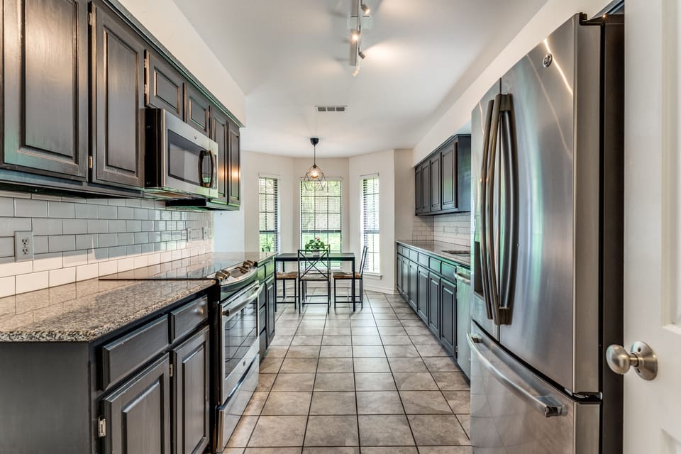 Cook your fav meals in a large kitchen stocked w/ plenty of serve & cookware