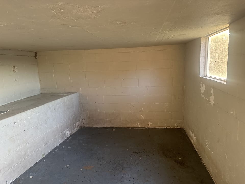 Storm cellar under back deck. 