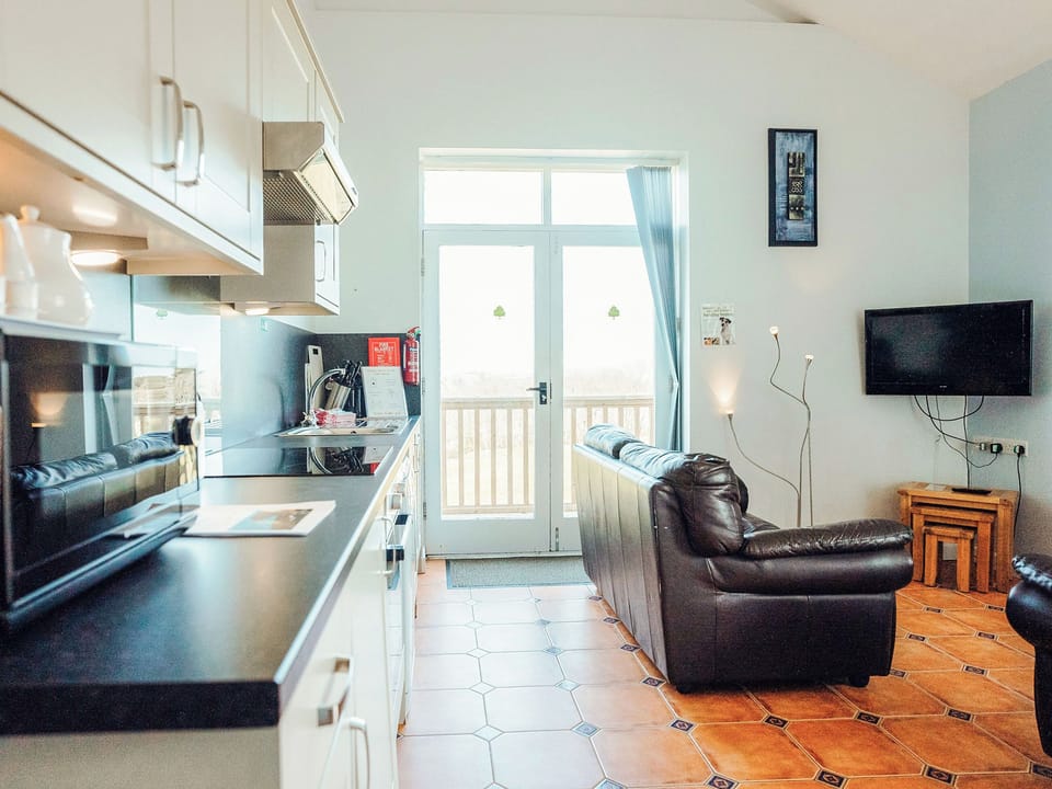 Open plan living space | Greenkeepers Cottage - Celtic Haven Resort, Lydstep, near Tenby